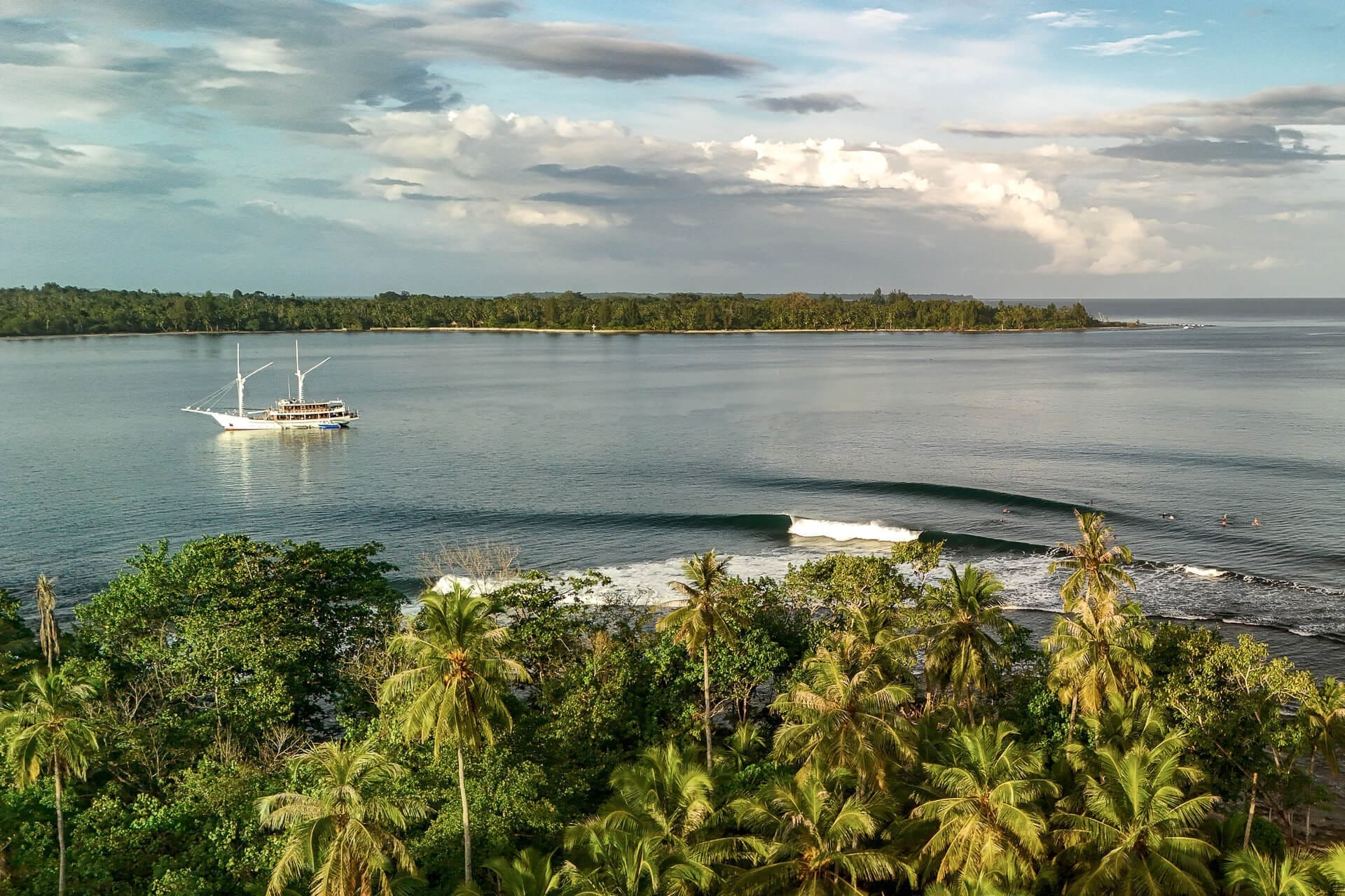Siloina 1 anchored near amazing surf break in Mentawai, West Sumatra.